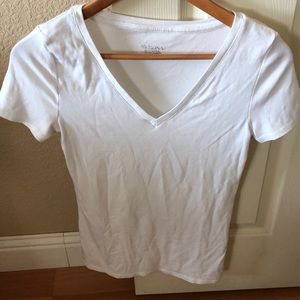 White v neck tee.
